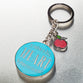 Metal Keyring in Tin: Blue, Apple, Let All That You Do Be Done in Love